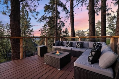 outside seating area with gas firepit. With amazing views of the lake. Sit here and you have a perfect view for the firework displays over the lake 
