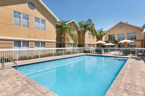 Linger poolside under blue skies with plenty of space.