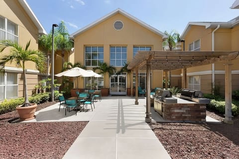 Gather for breezy evenings with grills and shaded seating.