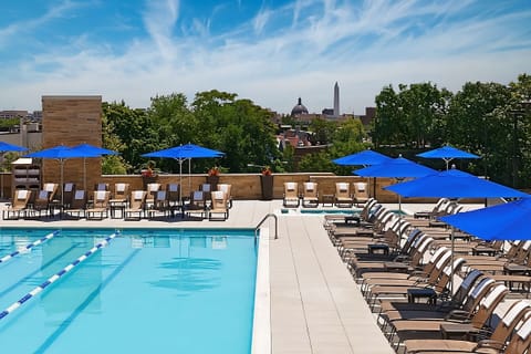 Unwind poolside with panoramic city views and crisp water.
