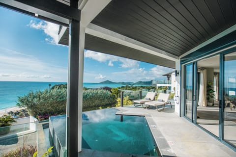 Dive into the infinity pool while soaking up ocean views.
