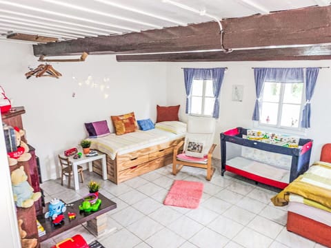Furniture, Interior Design, Room, Flooring, Floor, Textile, Lighting, Home, Cushion, Bedroom