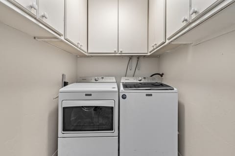 Convenient in-home laundry room with full-size washer and dryer for extended stays.