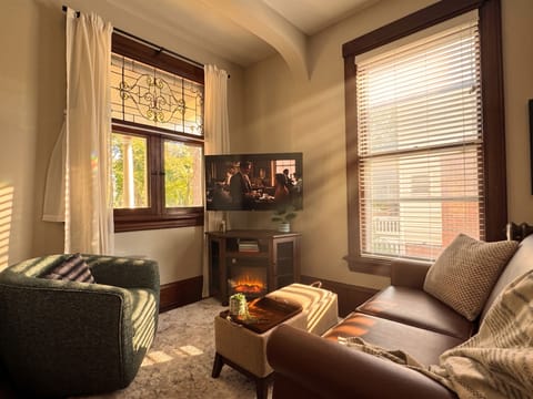 Relax in the coxy living room with padded ottoman to put your feet up or flip the tray to enjoy a meal and a show.