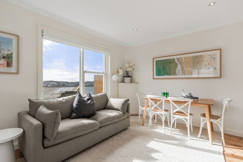 Thoughtfully selected artwork reflects Bondi's coastal character, creating a welcoming atmosphere in the living area.