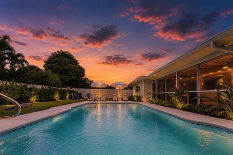 End your day with unforgettable Florida sunsets while relaxing beside the illuminated private heated pool.