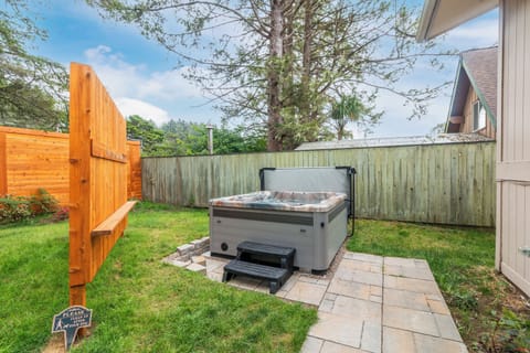 Soak away the day in your private hot tub, tucked into a peaceful backyard oasis with plenty of green space and fresh air.