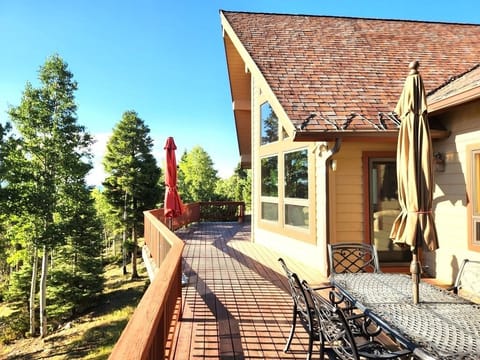 Exterior wrap around deck with extra umbrellas for shade.