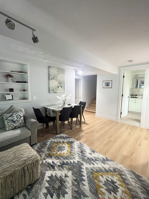 Bright, stylish living area with dining for four and a clean modern feel