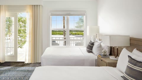 Step onto the patio from bright beds dressed in crisp whites.