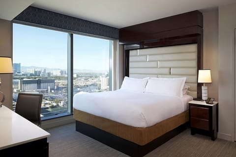 Wake up to sweeping city views from a plush bed
