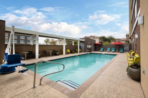 Dive into a sunny swim with loungers and umbrellas.