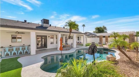 Private heated pool with tanning shelf, basketball hoop, and your own backyard oasis under the Arizona sun.