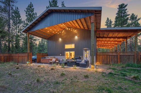 Your private outdoor oasis under the stars complete with lounging furniture, chairs, and a hot tub. 