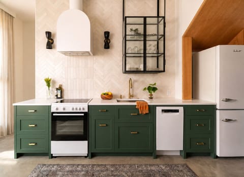Cook on the electric range, clean up easy with the dishwasher, sink.