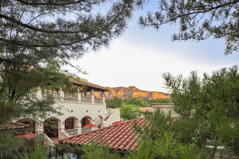 Wake up to mountain views above charming Spanish-style rooftops.