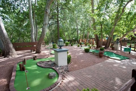 Play a relaxed round of mini-golf beneath shady trees.