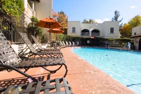 Stretch out on shaded loungers beside the shimmering water.