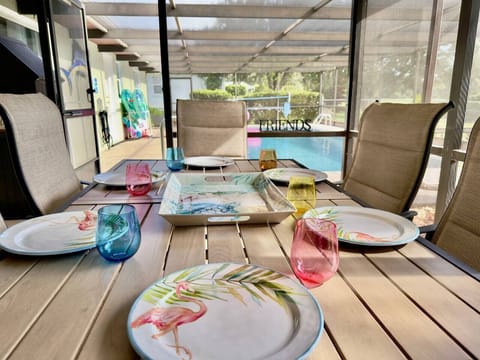 Screened in lanai with pool access. Table seats 6
