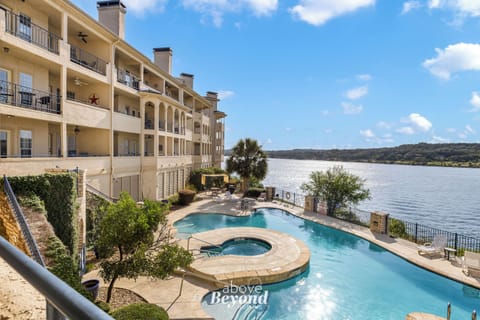 Resort-style waterfront pool and hot tub overlooking Lake Travis at The Island.