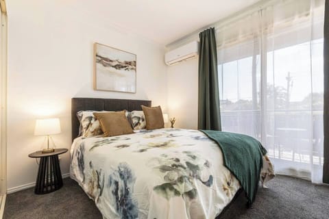 Rest comfortably in the bedroom, featuring a queen bed with quality linens and clothing storage for a clutter-free stay.