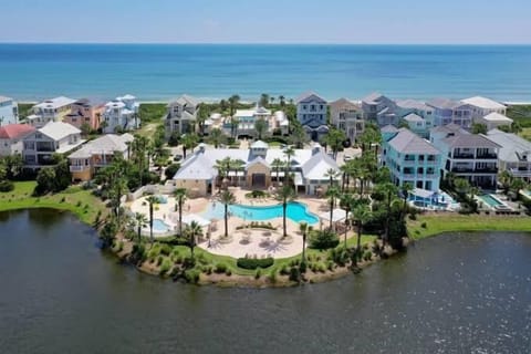 Aerial view of the Cinnamon Beach clubhouse pool, nestled between the lake and the Atlantic Ocean