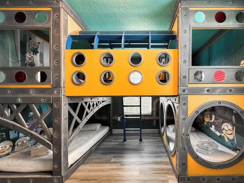 The Banana Minions Room (Sleeps 4).  A bright and playful Minions-inspired world featuring: 🛏️ 2 custom bunk beds. This room feels like stepping directly into the Minions universe.