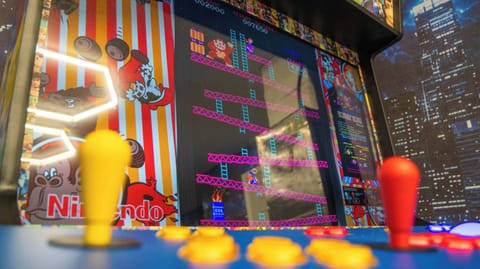 🎮 TRON-INSPIRED GAME ROOM

Included:

🕹️ 4-player multicade loaded with hundreds of classic arcade games
🏒 Multi-game table featuring:
- Air Hockey
- Foosball
- Ping Pong
- Card/Game Table

Guaranteed fun after leaving the theme parks.