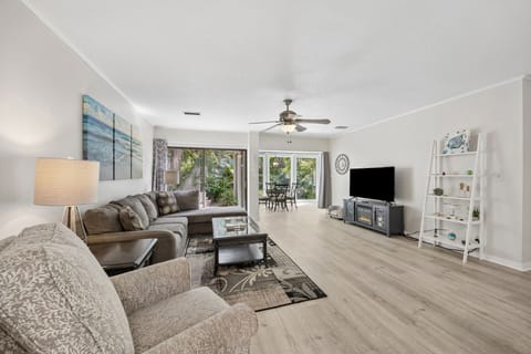 Living room with smart tv and views of garden area