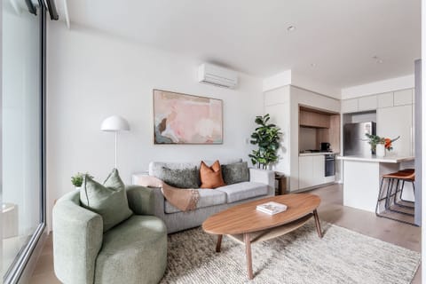 Playful pops of colour, curated artwork and greenery bring personality to the contemporary interiors, creating a welcoming retreat from the energy of the CBD.