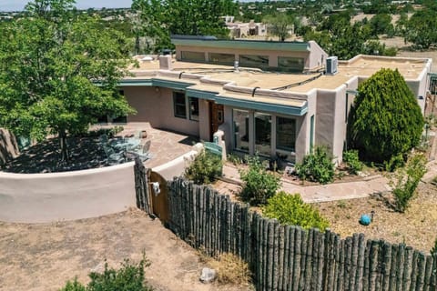 Pull up to a classic Santa Fe adobe on its own fully fenced lot