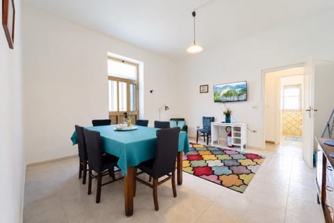 Bright open dining and lounge area with colorful accents and natural light