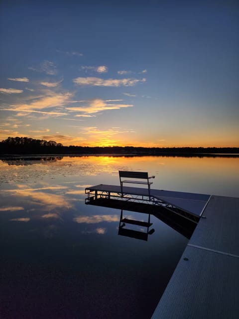 R&R Lakehouse faces West for a beautiful sunset view from the living room, porch or dock