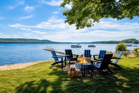 Stunning lakeside seating area and firepit overlooking the water! 🌊⛵️☀️