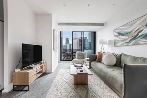 Stretch out on the plush sofa and enjoy a quiet night in with your favourite TV shows, surrounded by soft lighting and glimpses of Melbourne’s skyline.