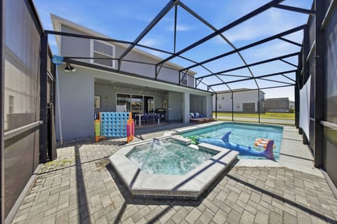 Private pool and hot tub create the ultimate backyard relaxation experience.