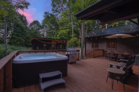 Splash into this beautiful home with hot tub, fire pit, extra bunkhouse, and so much More!