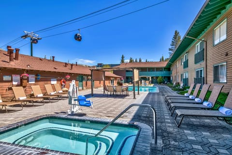 Sink into the bubbling hot tub after sunny pool time.