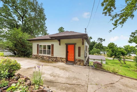 Storybook curb appeal with original stone and a classic red door