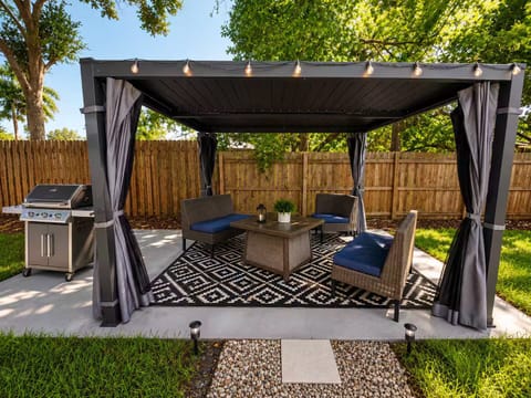 Enjoy the shaded backyard lounge, perfect for morning coffee!