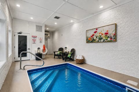 Private indoor plunge pool with cozy lounge seating and spa-like ambiance