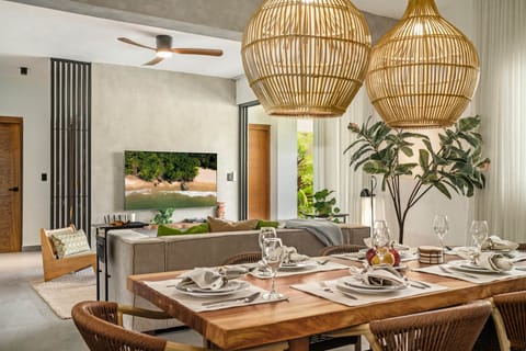 Spacious living room that opens up to pool-side terrace