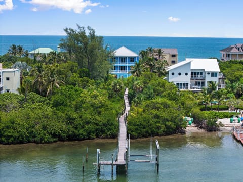 Enjoy a private dock along the Indian River Lagoon, just minutes by boat from the St. Lucie Inlet, with the Atlantic Ocean directly across from the home.