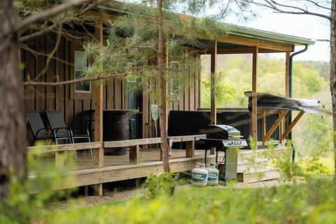 Porch Paradise: Unwind on the spacious deck with scenic views and a grill for outdoor feasts!