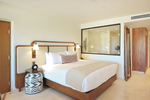 Stretch out in crisp linens with warm bedside lighting.