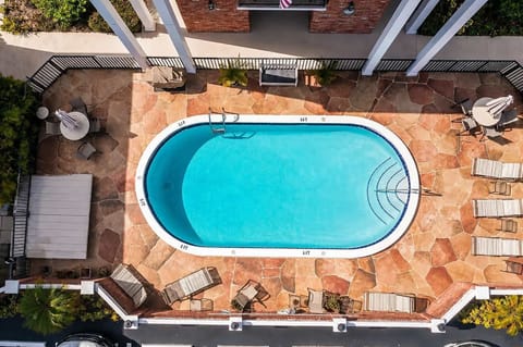 Shared outdoor pool for a refreshing swim and relaxing by the water.