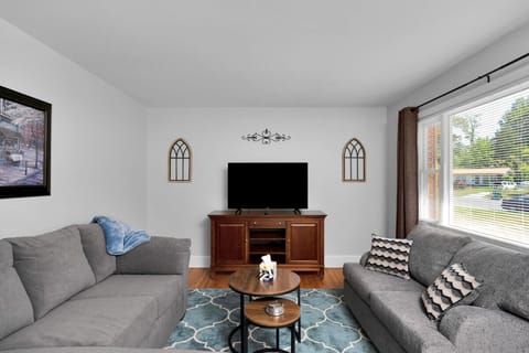 Comfy living room with lots of natural light. 