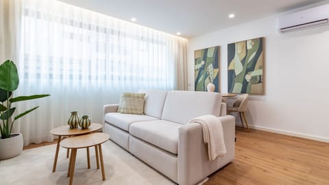 The open-plan living and dining area provides a seamless flow for entertaining or simply unwinding, bathed in natural light and adorned with tasteful decor. #OpenConcept #LivingDining #StylishDecor #BrightInterior #ComfortableStay #AptLife