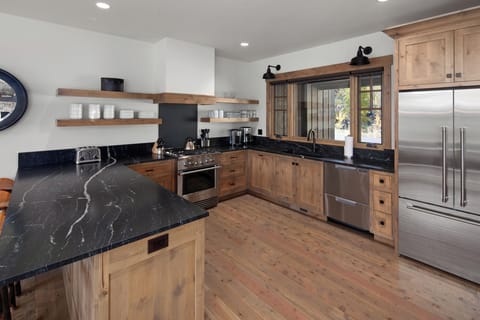 Cook effortlessly in a chef-ready kitchen with sleek stone counters.