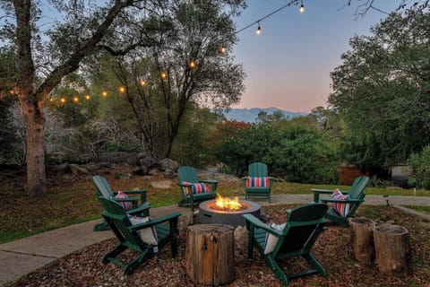 Firepit Gathering Area – End your day under the stars with good company.